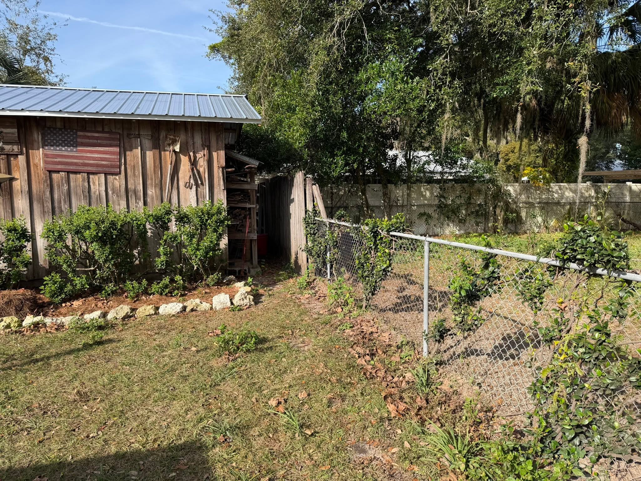 Old chain-link and wood fence before replacement